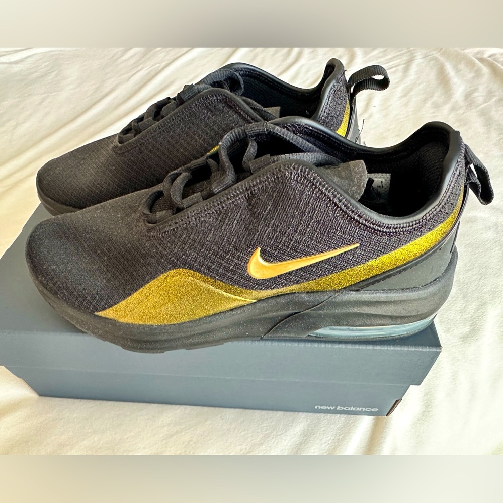 Gold and black Nike Size 7